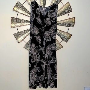 Beautiful black sleeveless dress with pink & green paisley work all throughout.